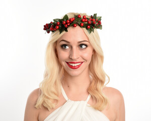 close up portrait of beautiful blonde female model wearing holly and ivy Christmas  fantasy wreath...