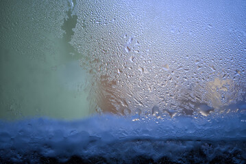 Close-Up View of Condensation on Glass Window During Winter Morning