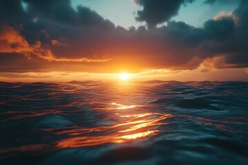 Obraz premium A serene sunset over a calm ocean, reflecting vibrant colors on the water's surface.