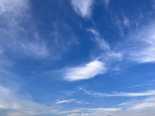 Majestic Sky View: Layers of Light Clouds Seamlessly Merging with Blue Horizon
