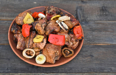 meat kebab and vegetables on a plate. close-up