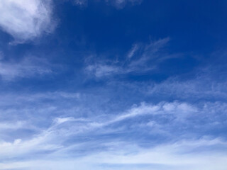Fototapeta premium Serene Azure Skies with Soft, Wispy Clouds - A Tranquil Heaven Above on West Lake in Hanoi, Vietnam