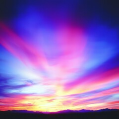 Vibrant Sunset Hues over Silhouetted Mountains