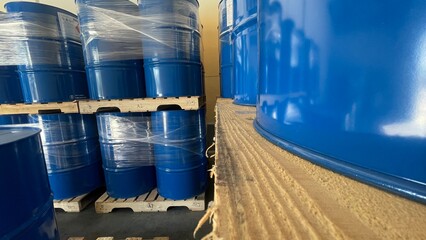 200-Liter Drums Stored on Pallets in a Warehouse for Efficient Shipping