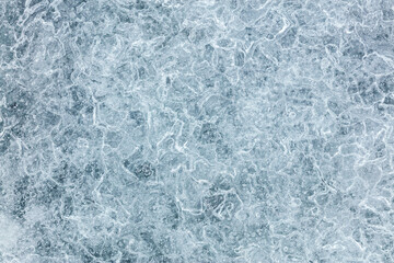 Fototapeta premium frozen river surface. icy textured winter background.
