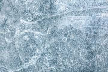 frozen river water with air bubbles. frosty ice structure. macro view.