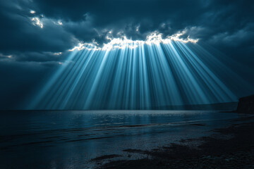 Dramatic sunlight beams over tranquil ocean seascape photograph moody atmosphere from below