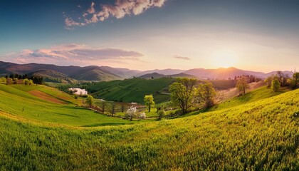 Obraz premium Sunset over the mountains with a scenic view of the countryside and rolling hills