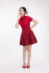 Full body portrait of joyful beauty Asian woman in red Cheongsam Chinese traditional dress celebrating on Chinese New Year festival.