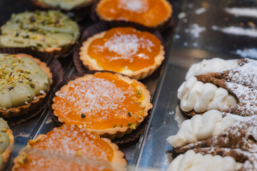 Display of Baked Tarts and Cannoli