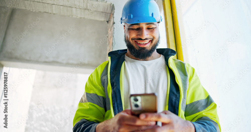 Leinwandbilder Man, phone and construction worker with texting, happy and contact with info for building development. Engineer, smartphone and smile with low angle, notification and click on mobile app at property