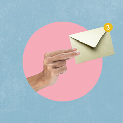 Human hand holding envelope letter with a colored background