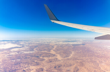 Fototapeta premium Aerial view on arabian desert and Red sea mountains from airplane
