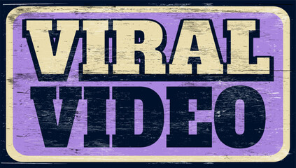 Aged and worn viral video sign on wood