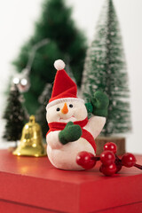 Festive Snowman Decoration With Red Hat On Holiday Gift Box