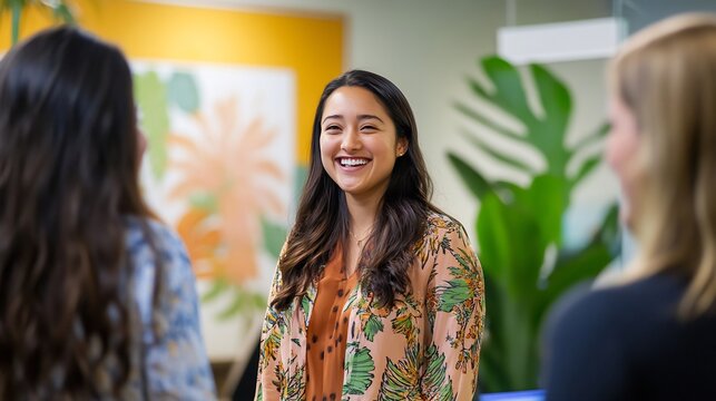 Enthusiastic Team Welcomes New Colleague in Vibrant Modern Office Setting