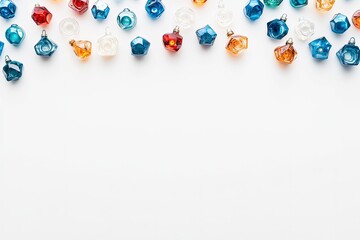 Dreidels and menorah on white background with space for text, top view. Hanukkah celebration 