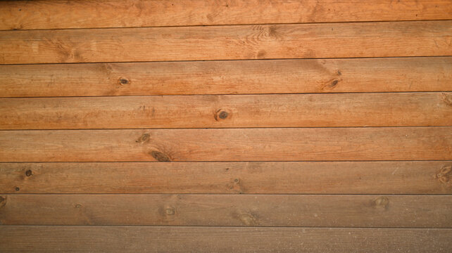 siding is in the form of a wooden log wall. background