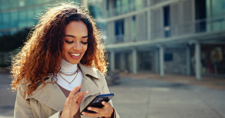 Fototapeta premium Phone, happy and business woman in city for text, check schedule or reading email for zoning regulation. Mobile, outdoor and worker on chat app, urban planning and development for project on internet
