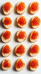 Delicious salmon roe spread artfully arranged on toasted bread, perfect for gourmet appetizers or parties.