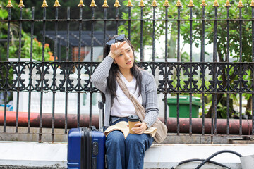 Young Woman Wiping Sweat From Forehead Feeling Unhappy With The Hot Climate of Tropical City