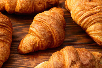 Group of sweet croissant . French morning breakfast . Top view
