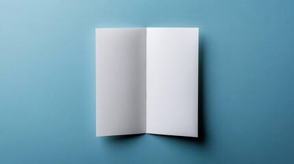 Naklejka premium Blank Trifold Brochure Mockup on Navy Blue Desk with Natural Lighting
