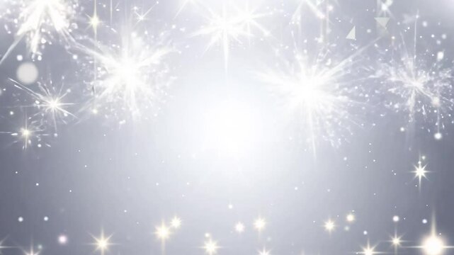 Video features a bright silver background with shimmering, star-shaped sparkles and soft bokeh lights