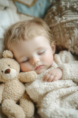 Sweet sleeping baby boy with a teddy bear
