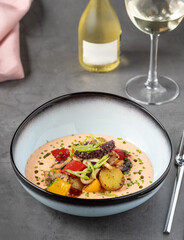 Grilled octopus with creamy sauce, potatoes and vegetables