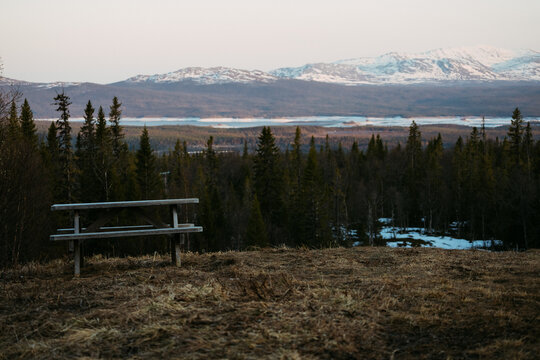 Picnic Bench Overlooking Snowy Mountains