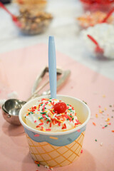 Closeup of Ice Cream Sundae with sprinkles and toppings