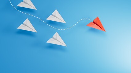 group of blue paper planes are sailing in one direction, one red is sailing in the opposite direction. The concept of an extraordinary personality, to act contrary to the foundations of society