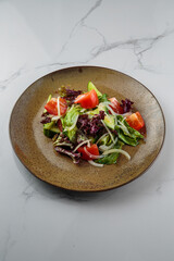 Tasty and juicy salads with sauces