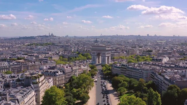 PARIS, FRANCE - OCTOBER 3, 2024: Aerial view of the Arc de Triomphe with scenic Paris skyline and vibrant greenery surrounding historic architecture