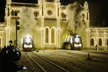 Christmas train with steam locomotive and illumination