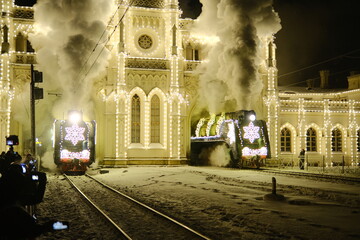 Christmas train with steam locomotive and illumination
