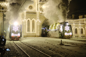 Christmas train with steam locomotive and illumination