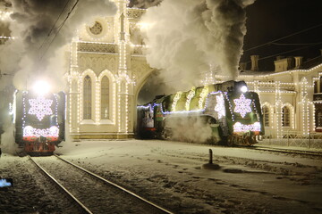 Christmas train with steam locomotive and illumination