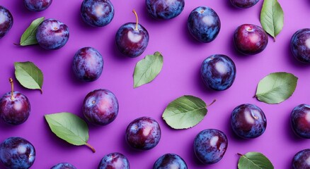 A vibrant display of plums and leaves on a purple background.