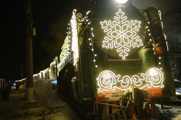 Christmas train with steam locomotive and illumination