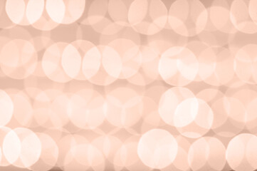 abstract bokeh background, blurred lights in color of the year 2025 Mocha Mousse, Christmas theme. High quality photo