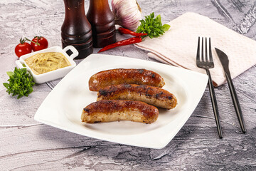 Delicous natural roasted sausages in the plate