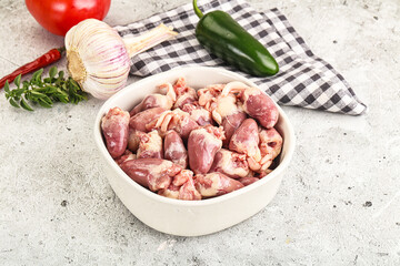 Fresh raw chicken hearts in the bowl
