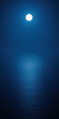 Obraz premium A breathtaking panoramic view of the moonlit sea at night, with soft moonlight reflecting on the calm water creating a romantic and serene atmosphere, water, night