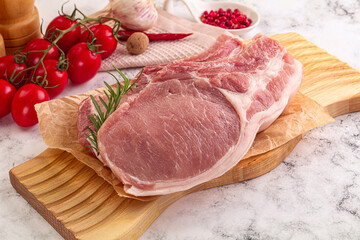 Raw potk loin steak with bone
