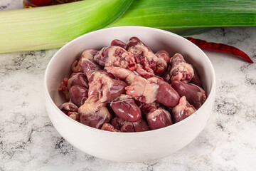 Raw chicken hearts in the bowl