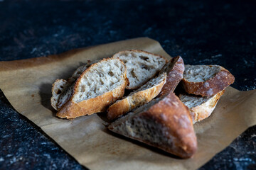 homemade baguette sliced and stacked on table