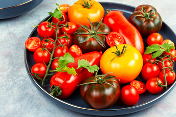 Tomatoes of different varieties in a plate