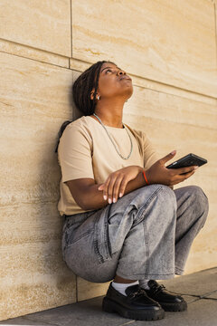 Young African American frustrated and upset outdoors urban building